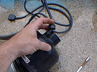 Removing the electrical cord strain relief