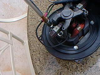 Removing the grounding screw from the blower frame
